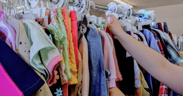 Photo of someone hanging children's clothing